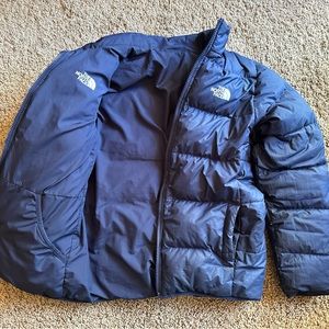 The North Face reversible youth puffy jacket.